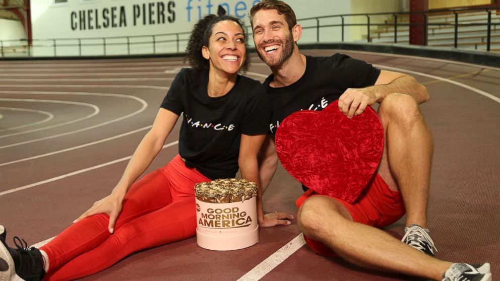 PHOTO: Engaged trainers Bree Branker and CJ Koegel demonstrate a couples workout at Chelsea Piers in New York City.