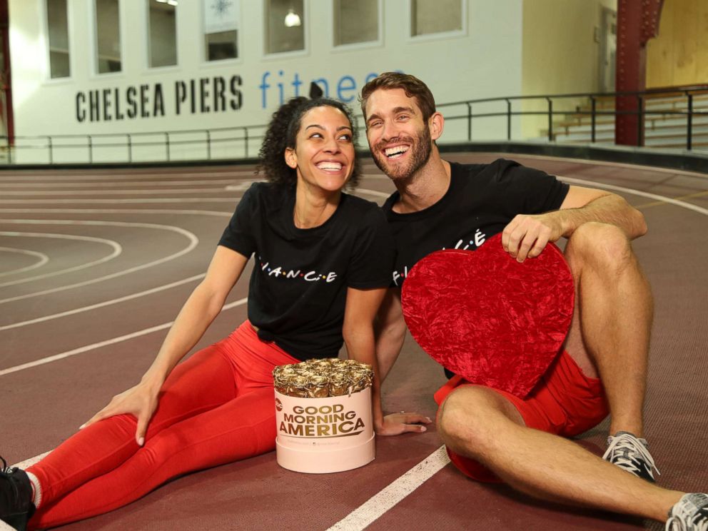 PHOTO: Engaged trainers Bree Branker and CJ Koegel demonstrate a couples workout at Chelsea Piers in New York City.