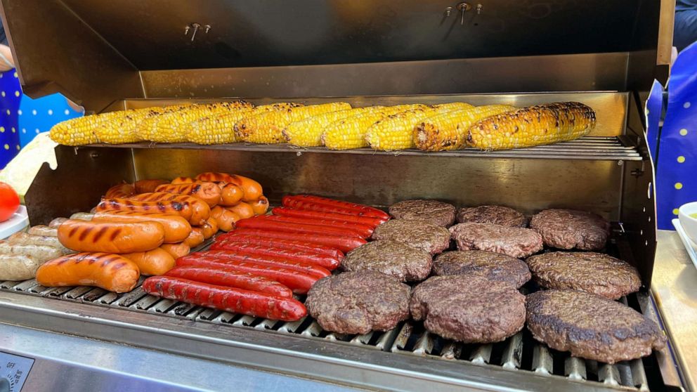 PHOTO: A grill of corn, hot dogs and burgers.