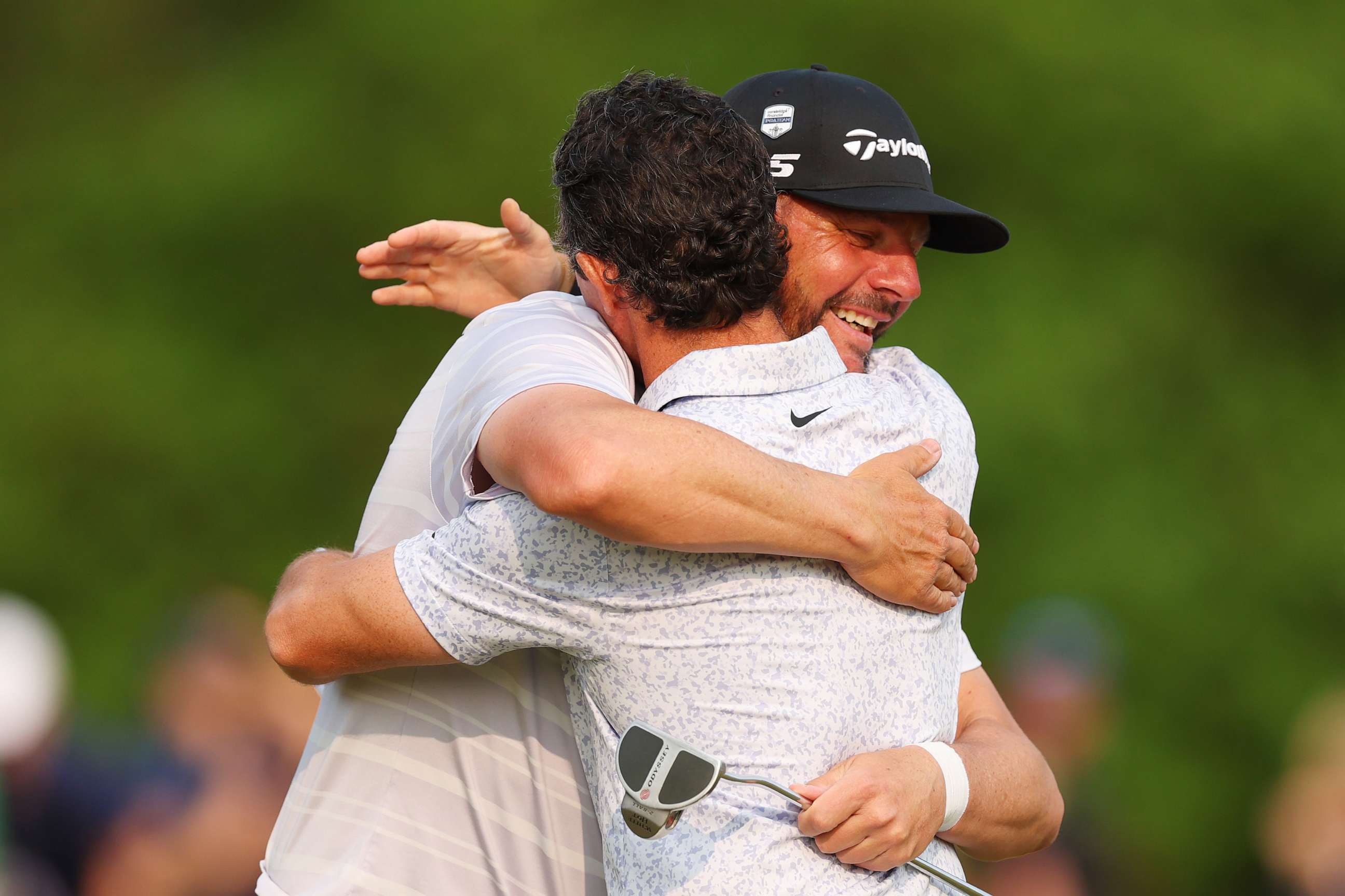 PHOTO: Michael Block, PGA of America Club Professional, and Rory McIlroy congratulate each other on the 18th green during the final round of the 2023 PGA Championship at Oak Hill Country Club on May 21, 2023 in Rochester, N.Y.