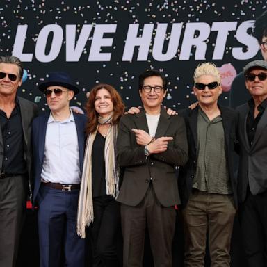 PHOTO: (L-R) Josh Brolin, Jeff Cohen, Kerri Green, Ke Huy Quan, Corey Feldman and Chris Columbus attend the hand/footprint in cement ceremony for actor Ke Huy Quan at TCL Chinese Theater February 03, 2025 in Hollywood, California.