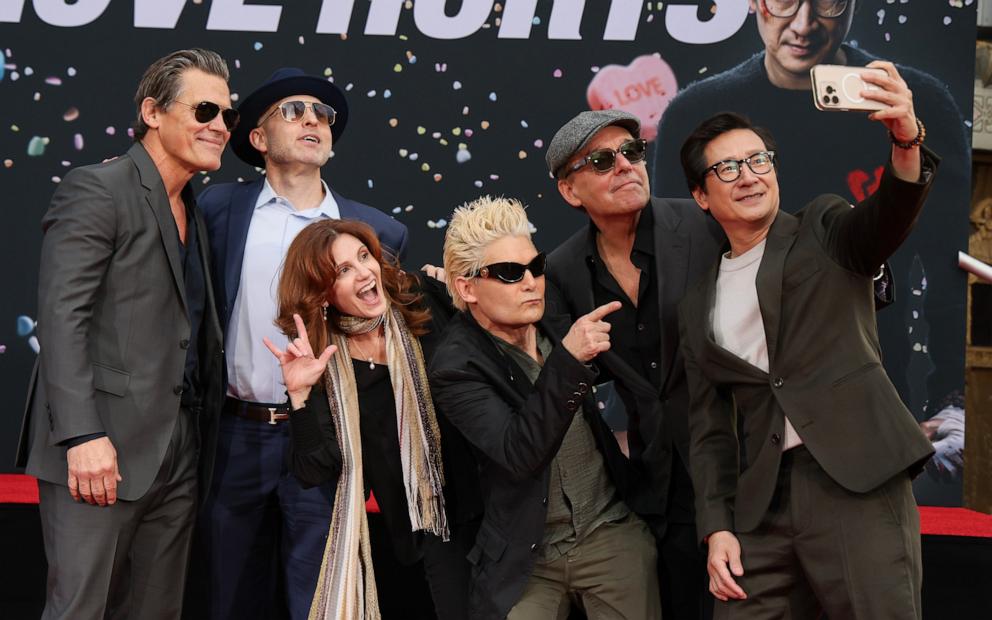 PHOTO: (L-R) Josh Brolin, Jeff Cohen, Kerri Green, Corey Feldman, Chris Columbus, and Ke Huy Quan attend the hand/footprint in cement ceremony for actor Ke Huy Quan at TCL Chinese Theater February 03, 2025 in Hollywood, California.