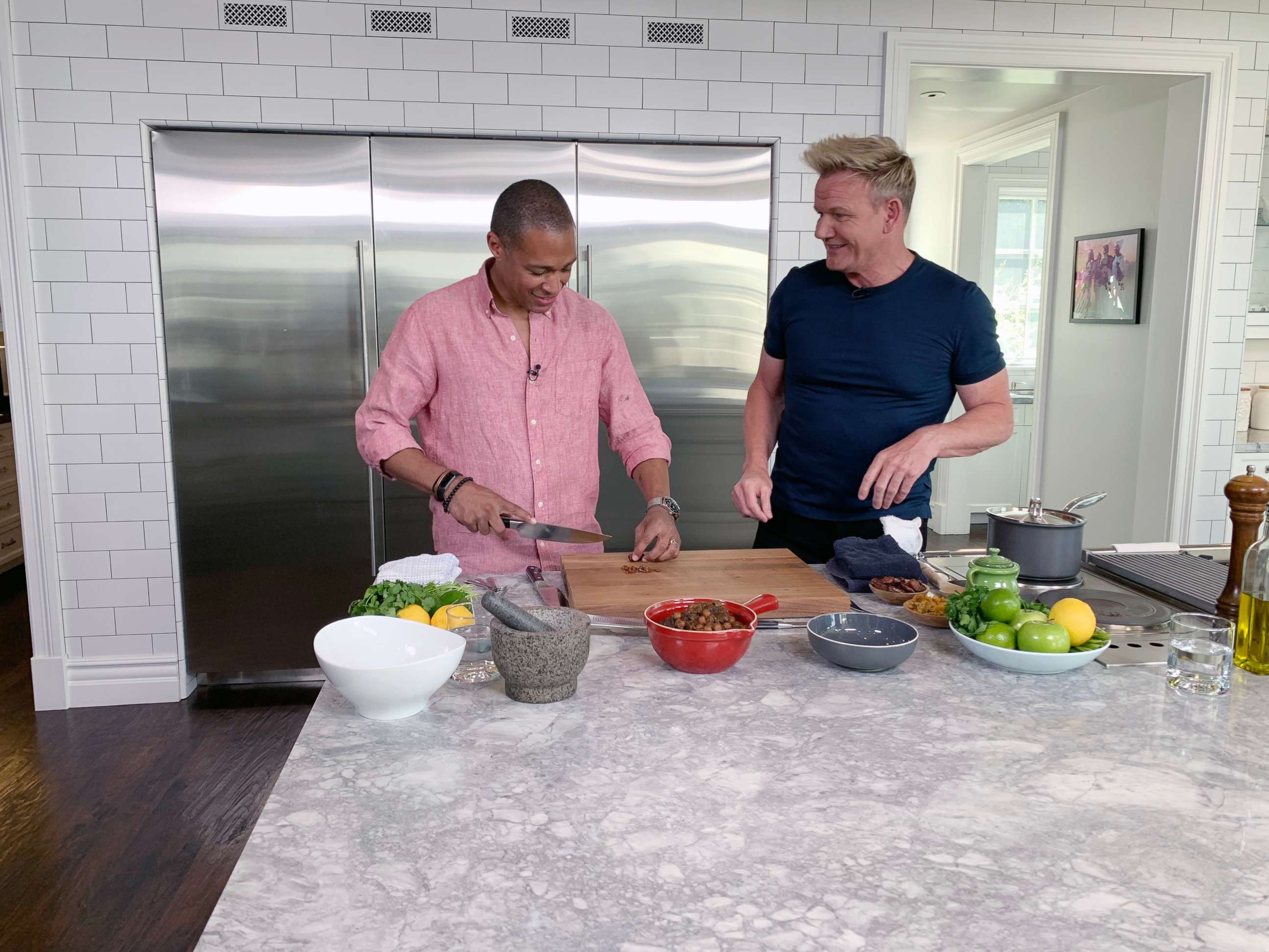 PHOTO: TJ Holmes chops dates with Gordon Ramsay for a Moroccan-inspired dish.
