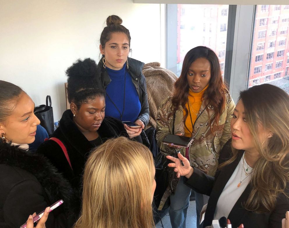 PHOTO: Grace Lee explaining the makeup behind Cushnie's fall 2019 show with press.