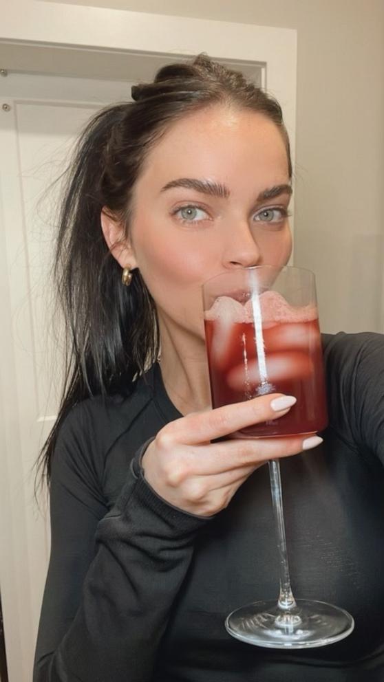 PHOTO: Gracie Norton holds a glass of her now-viral "sleepy girl mocktail."