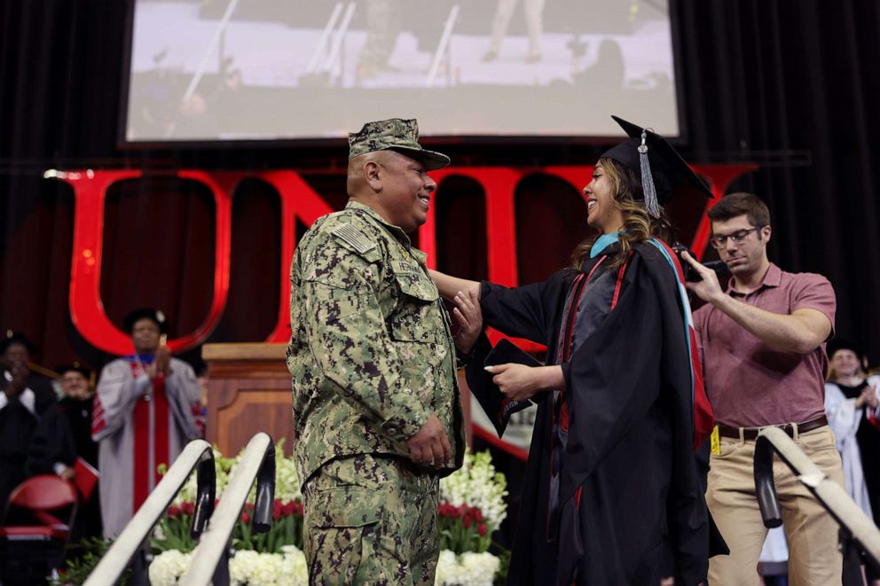 PHOTO: U.S. Navy Petty Officer Second Class Douglas Hernandez surprised his daughter Pamela as she graduated from the University of Nevada, Las Vegas, May 12, 2023.