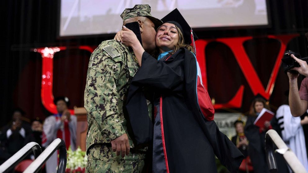 PHOTO: U.S. Navy Petty Officer Second Class Douglas Hernandez surprised his daughter Pamela as she graduated from the University of Nevada, Las Vegas.
