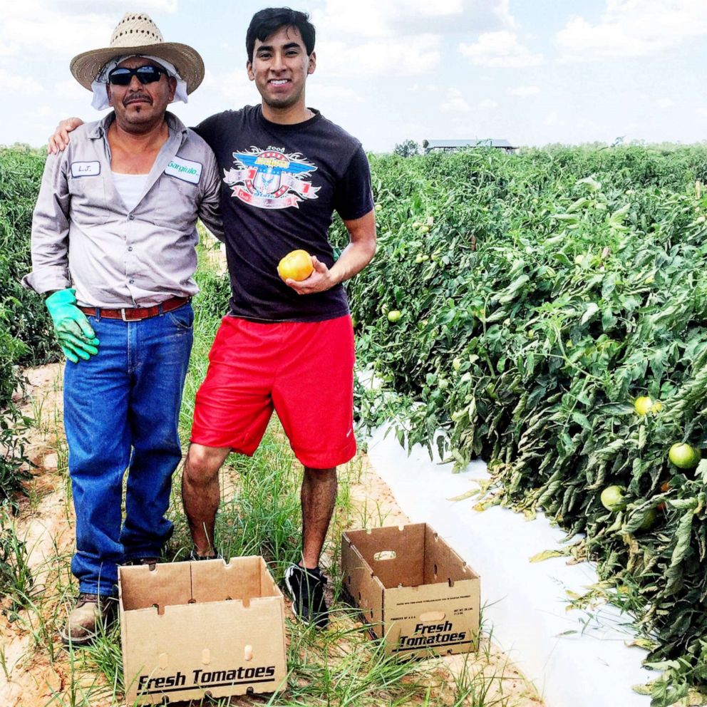 PHOTO: Erick Martínez Juárez, 29, and his father Loreto Juárez, 56, at a tomato field in Decatur County, Georgia.