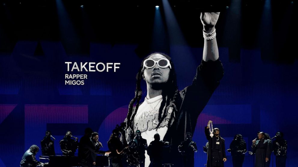 PHOTO: An image of the late Takeoff is projected while Quavo (4th R) and Maverick City Music perform onstage during the 65th GRAMMY Awards at Crypto.com Arena on Feb. 5, 2023 in Los Angeles.