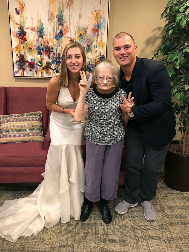 PHOTO: Lauren Parks, her grandmother and her husband Tommy pose at her grandmother's memory care facility.