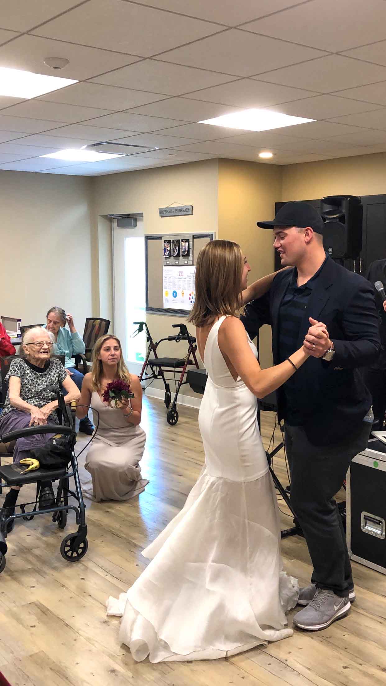 PHOTO:Lauren Parks and her husband Tommy share a dance in front of her grandmother and other members of the family care facility.