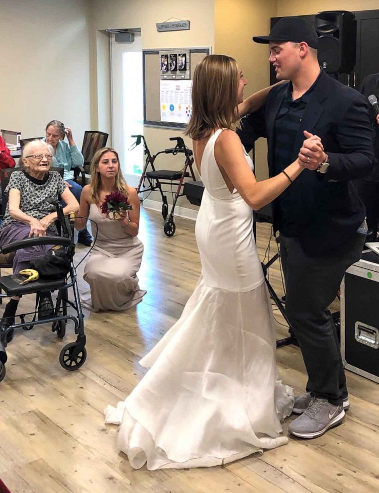 PHOTO:Lauren Parks and her husband Tommy share a dance in front of her grandmother and other members of the family care facility.