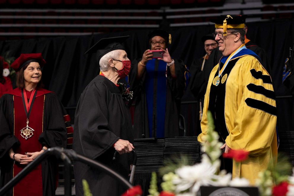 PHOTO: DeFauw walked across the stage to receive her diploma at Northern Illinois Universitys commencement stage Sunday.
