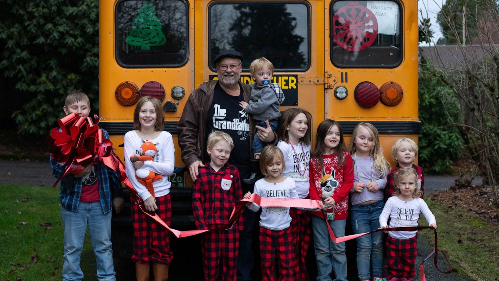 PHOTO: Doug Hayes of Grafton, Oregon, surprised Amara, 10, Christian, 9, Autumn, 8, Lily, 8, Gabriel, 6, Everett, 4, Piper, 4, Emma, 4, Hero, 2 and Teddy, 2, with a small, yellow school bus on Christmas morning.