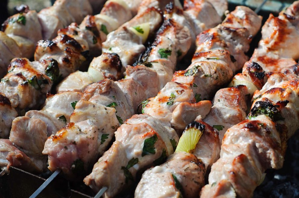 PHOTO: A traditional Greek meat barbecue is cooked on souvla or souvlaki skewers.