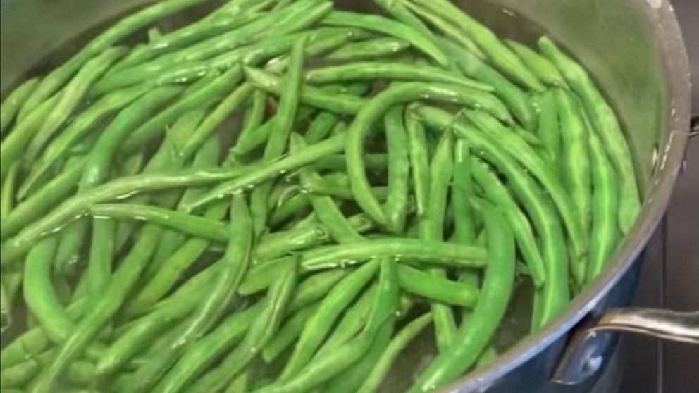 PHOTO: Green beans cooking in a boiling pot of salted water.