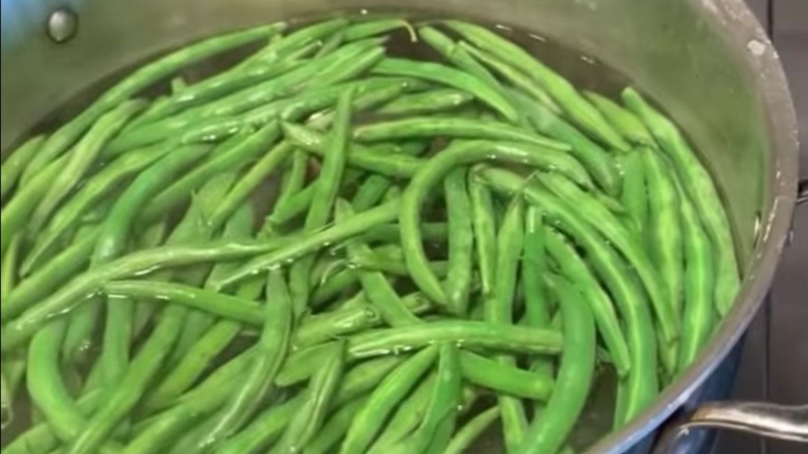 PHOTO: Green beans cooking in a boiling pot of salted water.