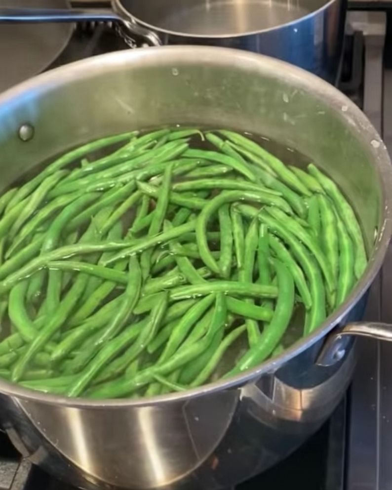 PHOTO: Green beans cooking in a boiling pot of salted water.