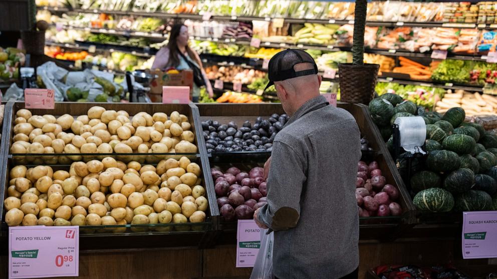 PHOTO: Customers shop in the produce section of a grocery store, May 11, 2026, in Portland, Ore.