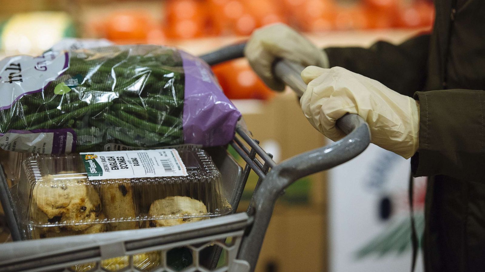 PHOTO: A customer wearing gloves shops at a Stew Leonard's supermarket in Paramus, N.J., May 12, 2020.