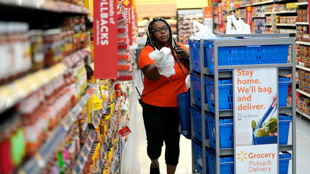 PHOTO: In this Nov. 9, 2018, file photo, a Walmart associate fulfills online grocery orders at a Walmart Supercenter in Houston.