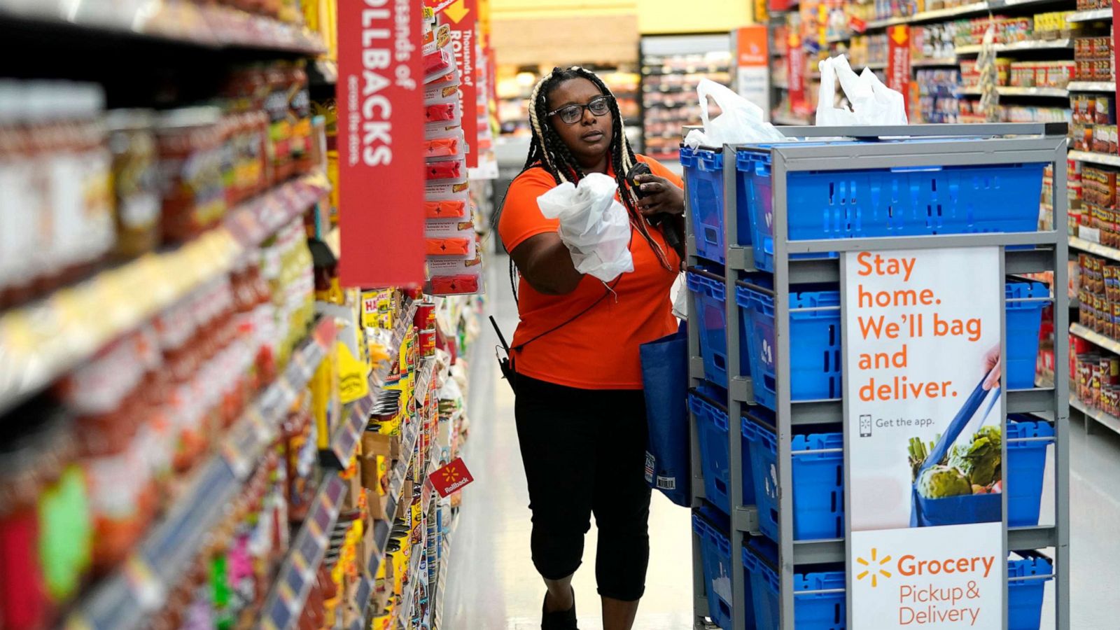 PHOTO: In this Nov. 9, 2018, file photo, a Walmart associate fulfills online grocery orders at a Walmart Supercenter in Houston.