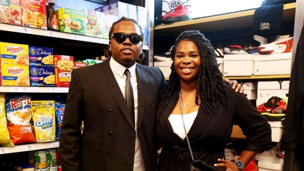 PHOTO: Hip-hop artist Gunnar poses with Goodr founder Jasmine Crowe at the grand opening of Gunna's Drip Closet and Goodr Grocery Store at McNair Middle School on Sept. 16, 2021.
