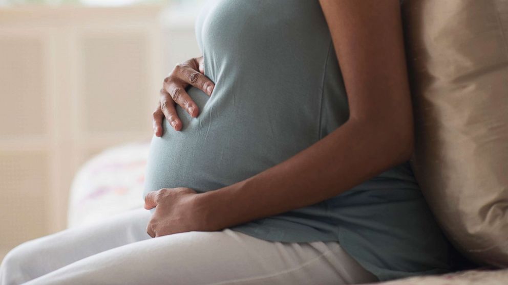 PHOTO: A stock photo depicts a pregnant woman cradling her stomach.