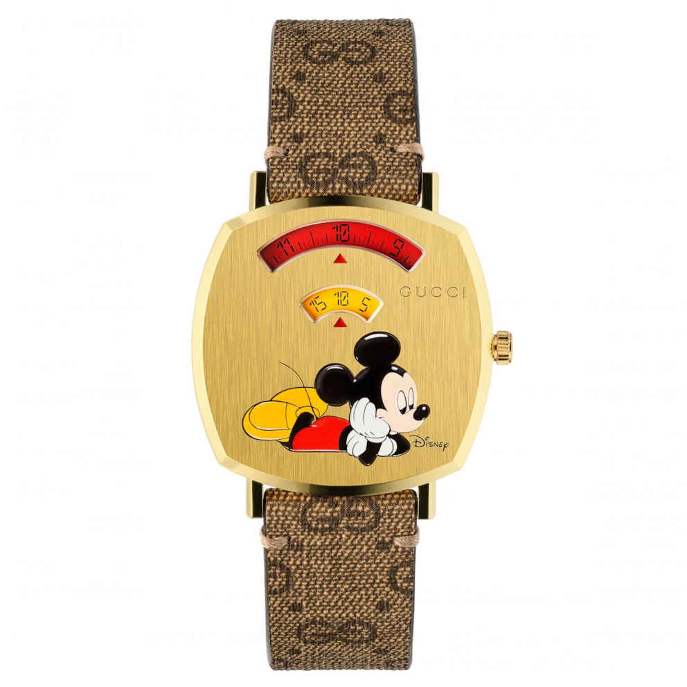 PHOTO: The Gucci Grip Mickey Mouse watch features a yellow gold PVD case and a GG Supreme canvas strap.