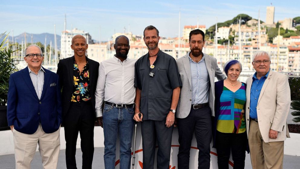 PHOTO: Guy Vendenberg, center, stands with reporter Hank Plante, actor Keiynan Lonsdale, Steve Williams, Dan Krauss, Alison Moed and Cliff Morrison during a photocall for the film "5B" at Cannes Film Festival in Cannes, southern France, on May 16, 2019.