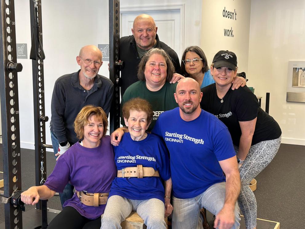 PHOTO: Merce Hershey poses for a photo with fellow gymgoers at the Starting Strength gym in West Chester, Ohio.