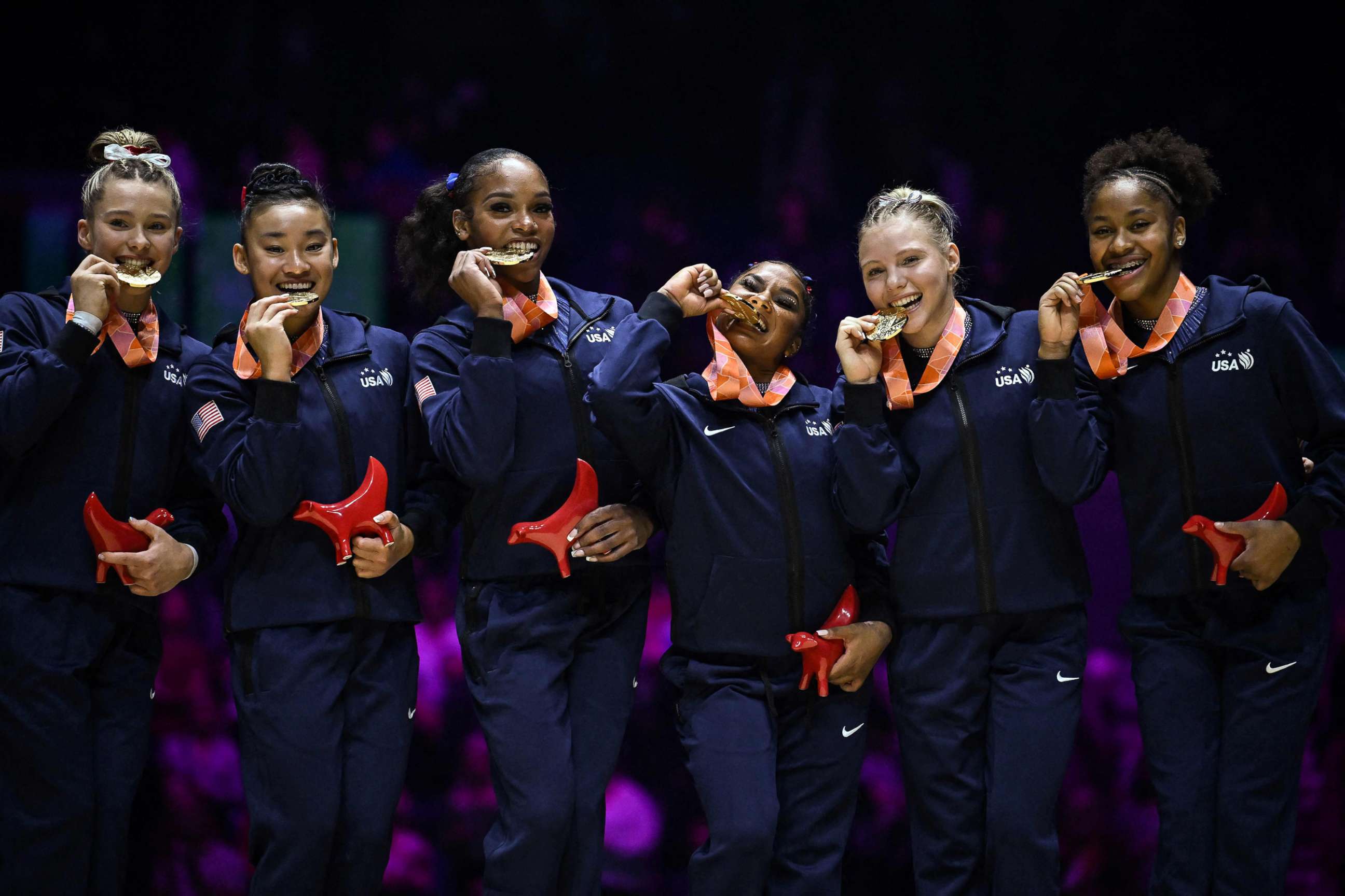 PHOTO: USA gymnasts celebrate with their gold medals after winning the women's team final at the World Gymnastics Championships, Nov. 1, 2022 in Liverpool, England.