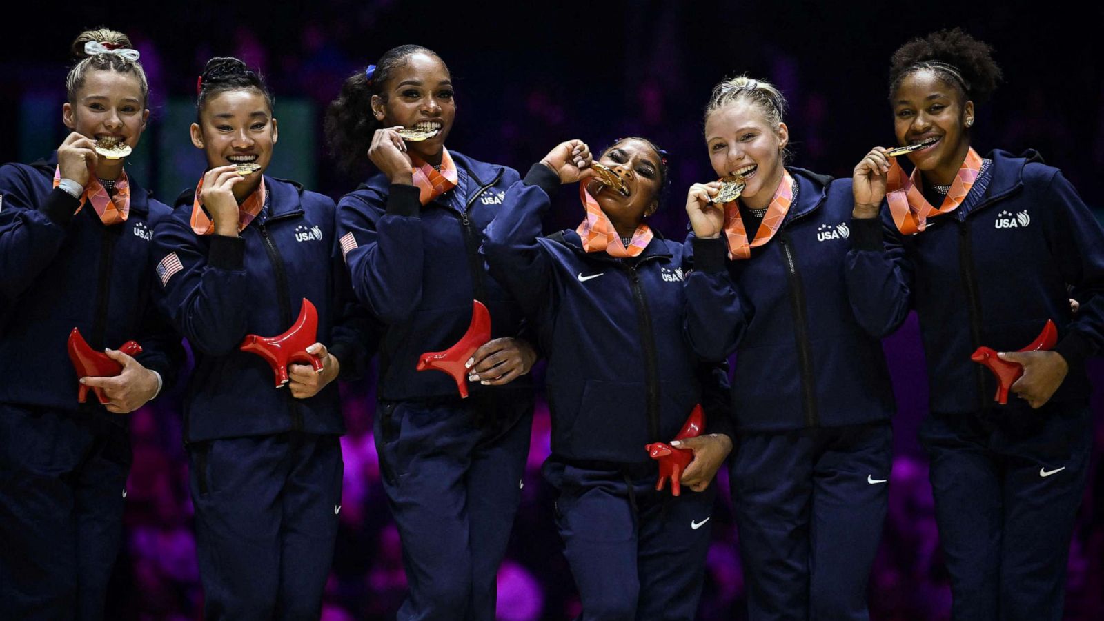 PHOTO: USA gymnasts celebrate with their gold medals after winning the women's team final at the World Gymnastics Championships, Nov. 1, 2022 in Liverpool, England.