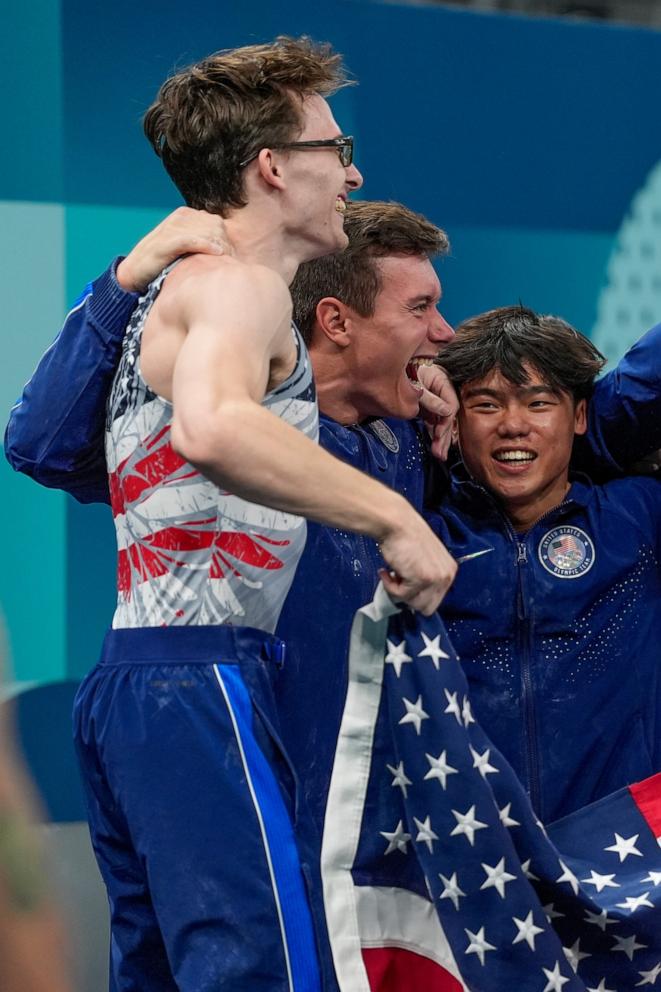 PHOTO: Stephen Nedoroscik, of United States, with Brody Malone and Asher Hong pommel during the men's artistic gymnastics team finals round at Bercy Arena at the 2024 Summer Olympics, July 29, 2024, in Paris.