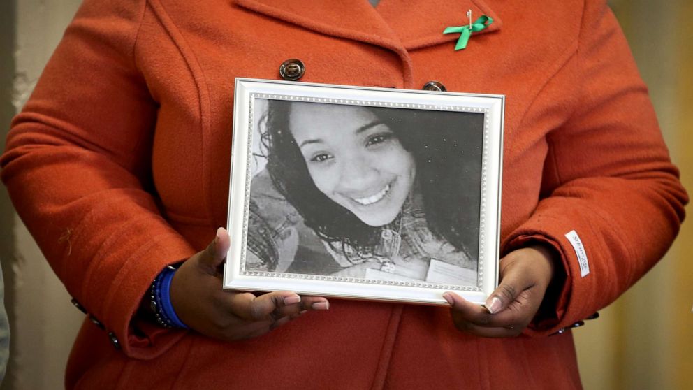 PHOTO: In this Dec. 14, 2013, file photo, Cleopatra Cowley-Pendleton holds a picture of her daughter Hadiya, 15, during a gathering of gun violence victims and gun control advocates at Cornell Square Park in Chicago.
