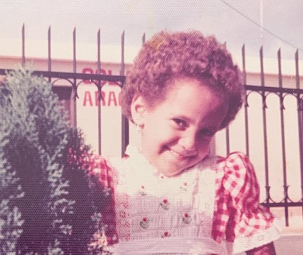 PHOTO: Miguelina German as a child poses for photo.