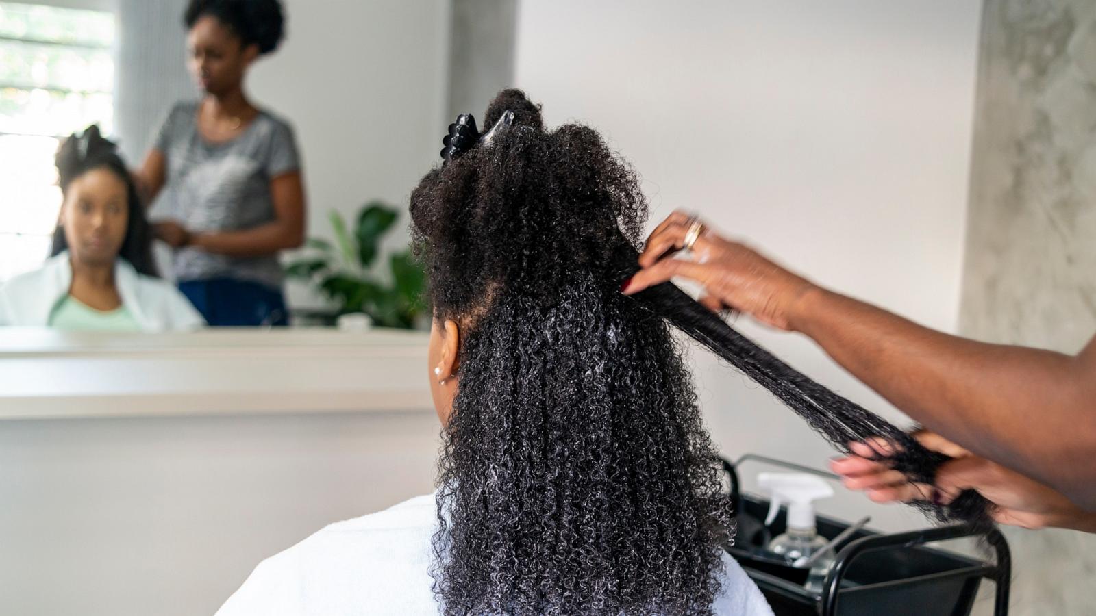 PHOTO: Stock photo of a woman getting her hair straightened at a salon.