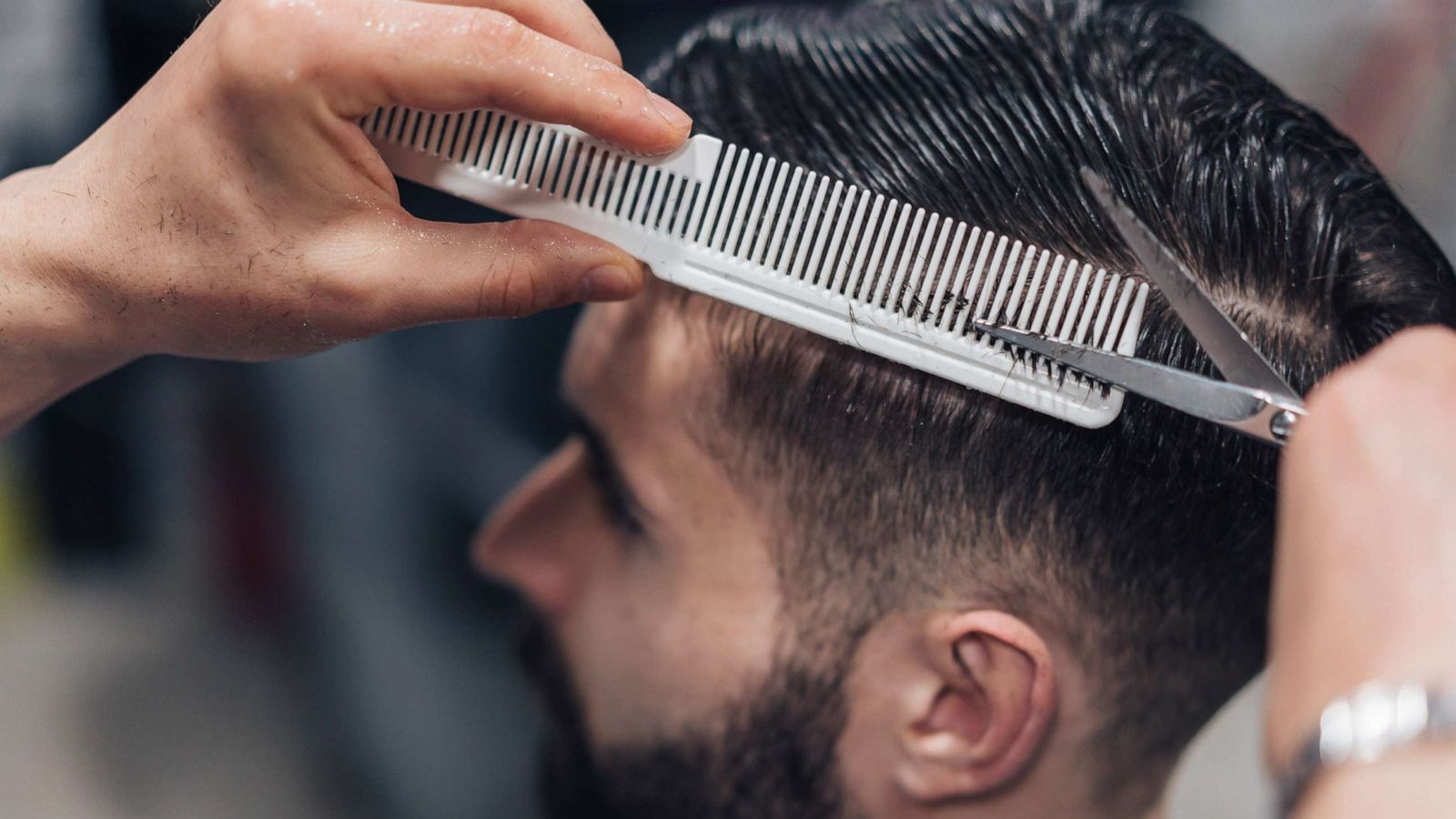 cutting hair with hair clippers