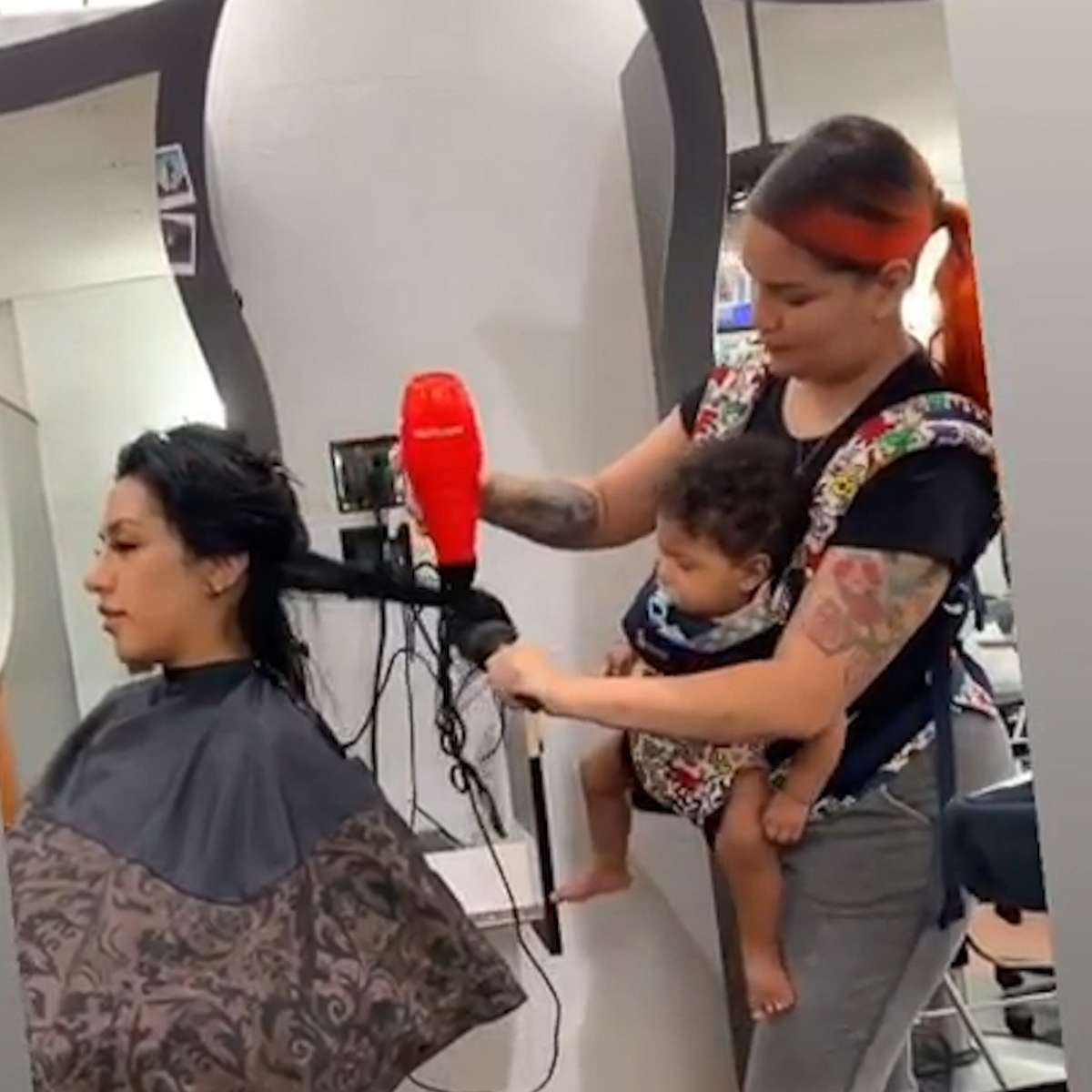PHOTO: Maria Khachotamraz took care of her longtime friend Jessica at the salon on Sept. 25 while her 9-month-old daughter Camila was strapped to her chest.