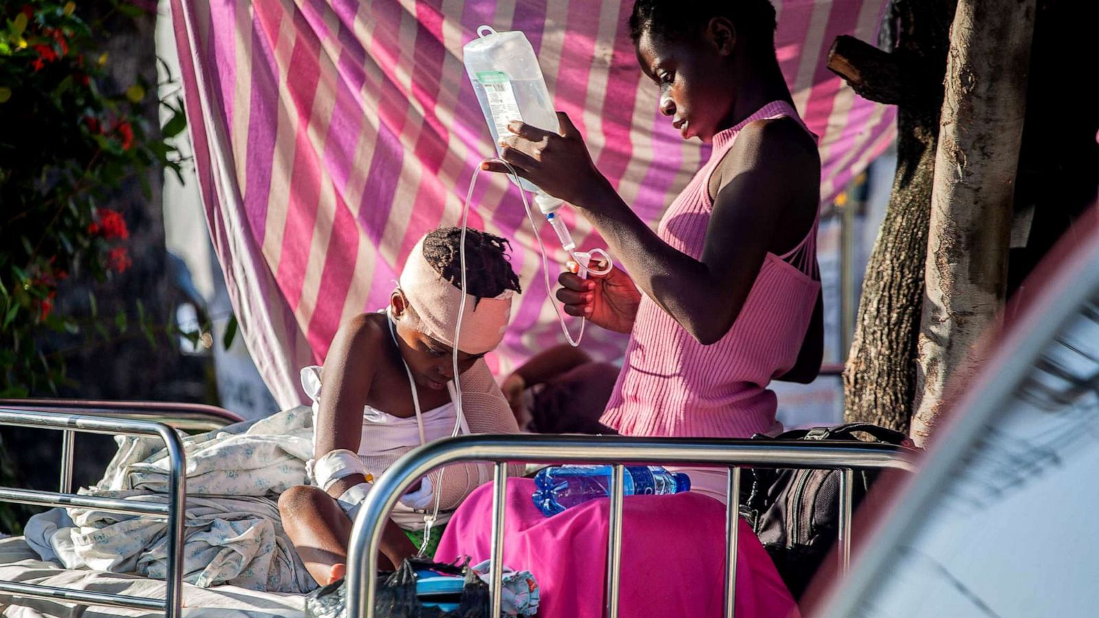 PHOTO: A boy is tended to outside Les Cayes General Hospital after a 7.2-magnitude earthquake on Aug. 15, 2021 in Les Cayes, Haiti. Rescue workers have been working among destroyed homes since the quake struck on Saturday.