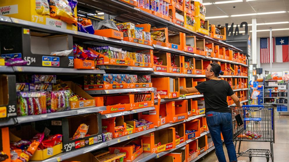 PHOTO: A customer shops for Halloween candy at a Walmart Supercenter store on Oct. 24, 2023 in Austin.