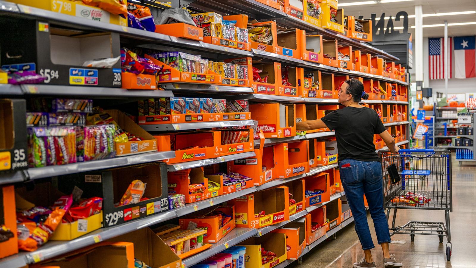 PHOTO: A customer shops for Halloween candy at a Walmart Supercenter store on Oct. 24, 2023 in Austin.