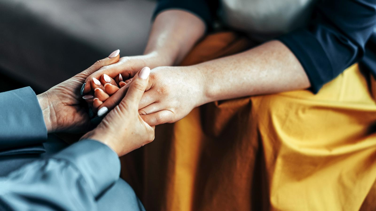 PHOTO: Stock photo of two women holding hands.
