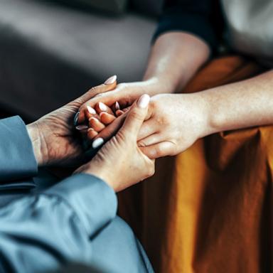 PHOTO: Stock photo of two women holding hands.