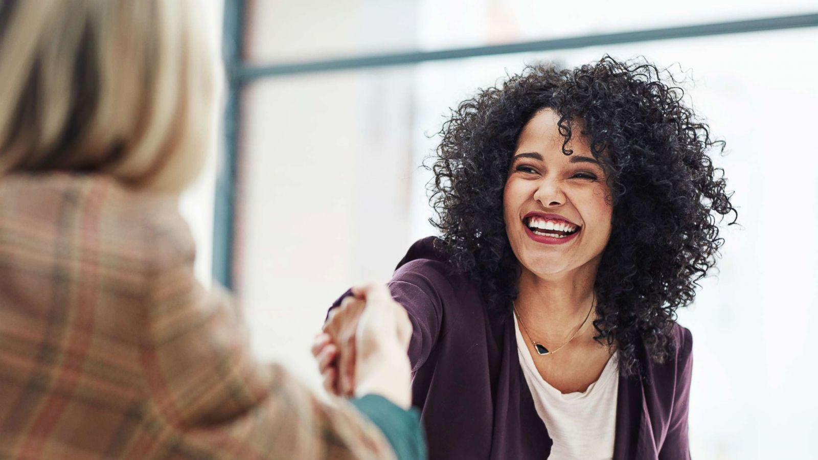 PHOTO: Two women shake hands during a meeting in this undated stock photo.