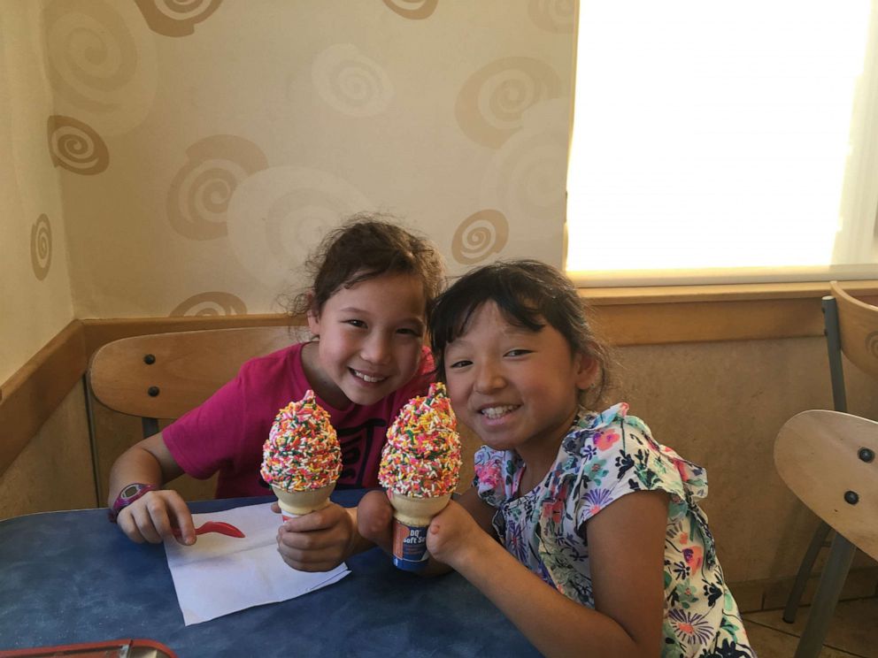 PHOTO: Sara Hinesley, right, enjoys an ice cream cone with her older sister, Veronica Hinesley.