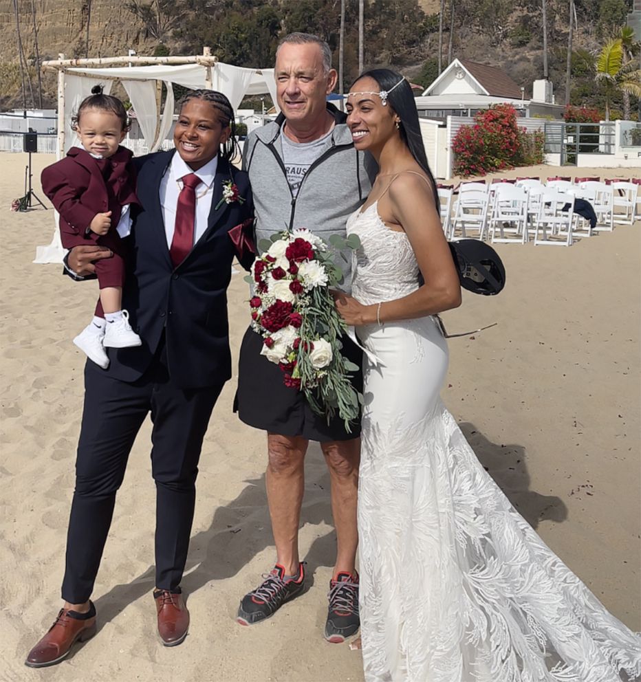 PHOTO: Actor Tom Hanks stopped to take photos with Diciembre and Tashia Farries in Santa Monica after their ceremony on the beach.