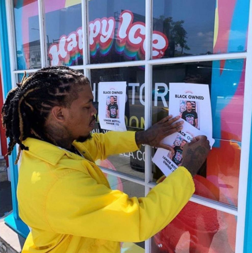 PHOTO: Lemeir Mitchell, owner of Los Angeles-based food truck Happy Ice, puts up "black-owned" fliers on his windows in wake of anti-racism protests. 