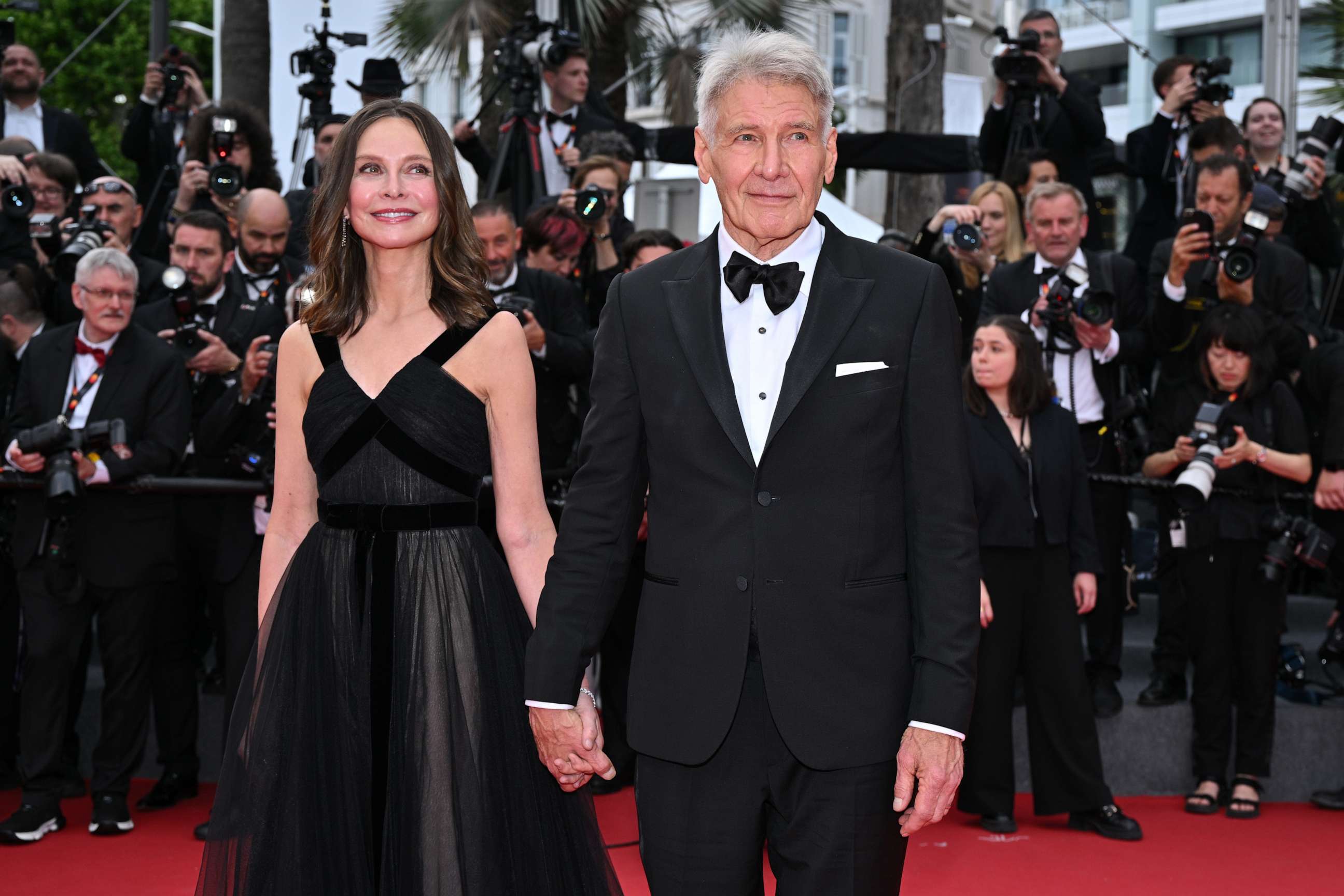PHOTO: Harrison Ford and Calista Flockhart attend the "Indiana Jones And The Dial Of Destiny" red carpet during the 76th annual Cannes film festival at Palais des Festivals, May 18, 2023, in Cannes, France.