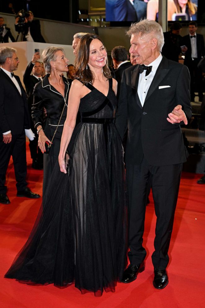 PHOTO: Calista Flockhart and Harrison Ford depart the "Indiana Jones And The Dial Of Destiny" red carpet during the 76th annual Cannes film festival at Palais des Festivals, May 18, 2023, in Cannes, France.